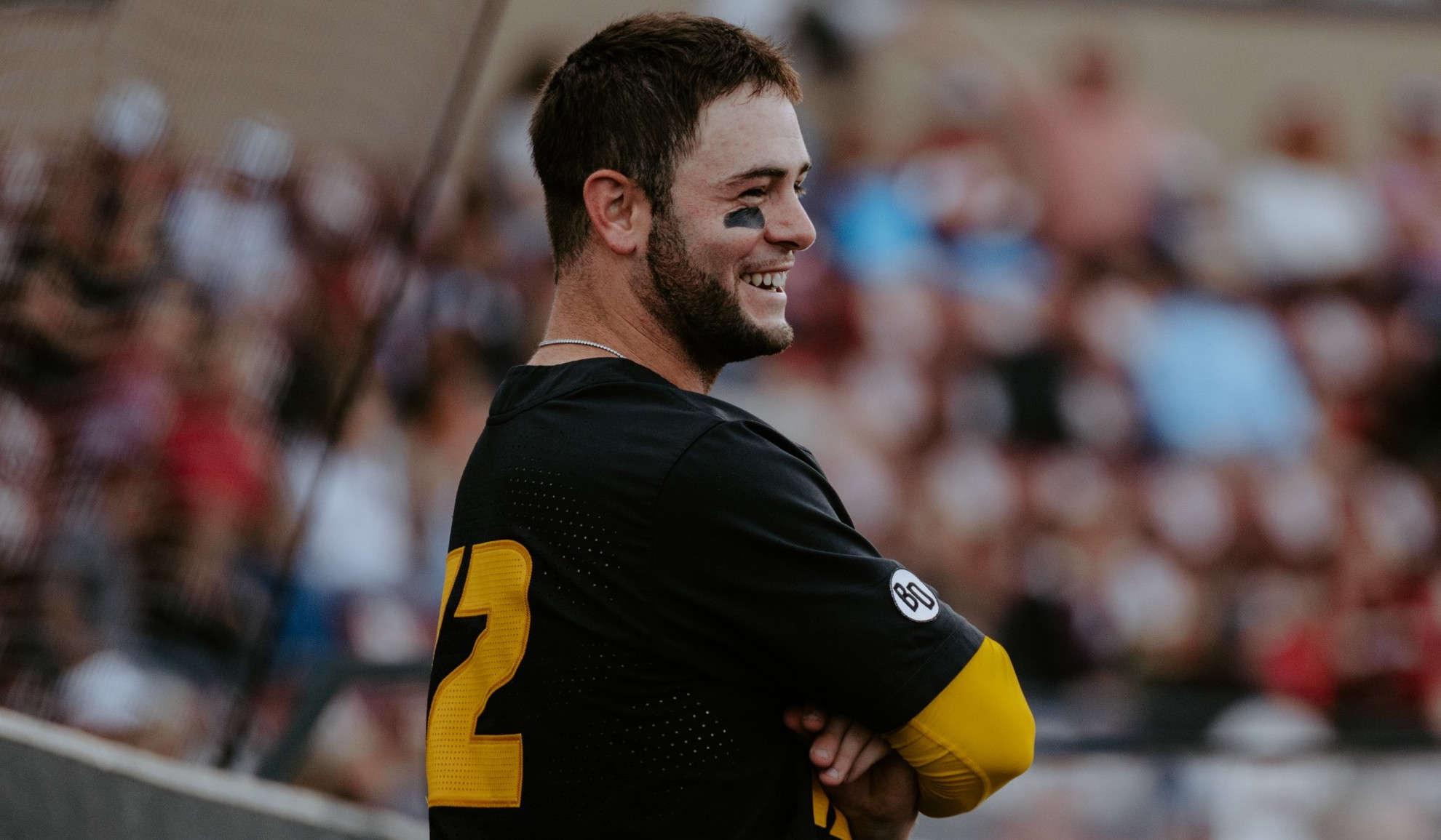 Mizzou baseball's Keegan Knutson smiles in the dugout